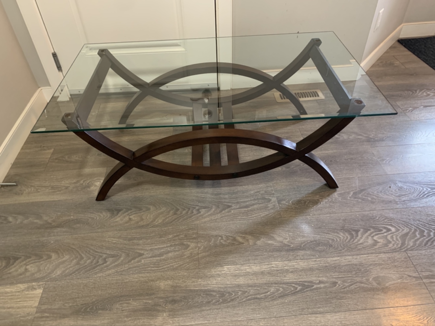 Glass top coffee table with dark brown wooden frame - photo 2