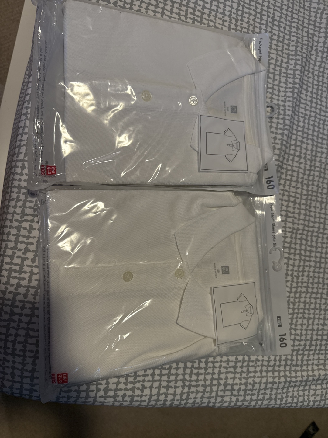 Two UNIQLO Kids' White Polo Shirts - Size 160