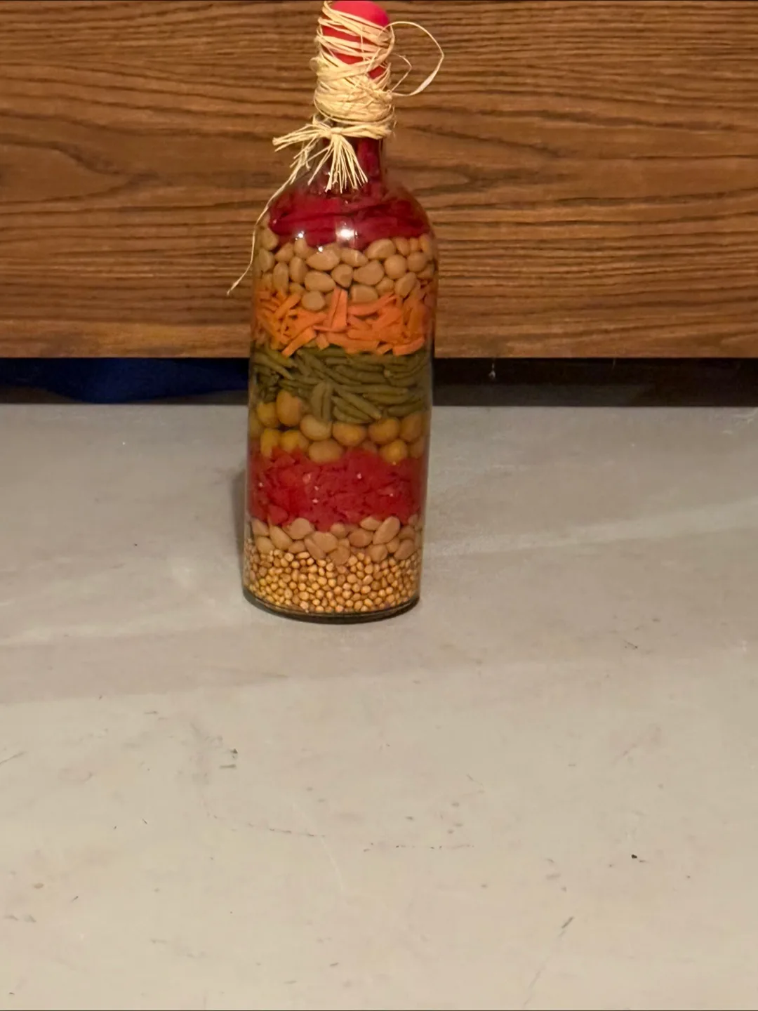 Unique Decor Bottle Filled with Layers of Beans and Pasta thumbnail