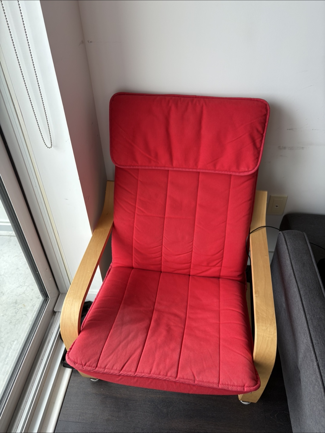 IKEA armchair with light wood armrests