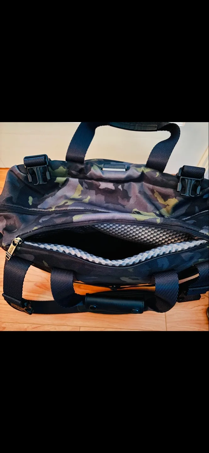 $900+ Like New, Tumi Camo Leather Duffle Bag image indicator(6)