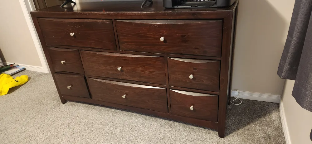 Dark brown wooden dresser with nine drawers image indicator(2)