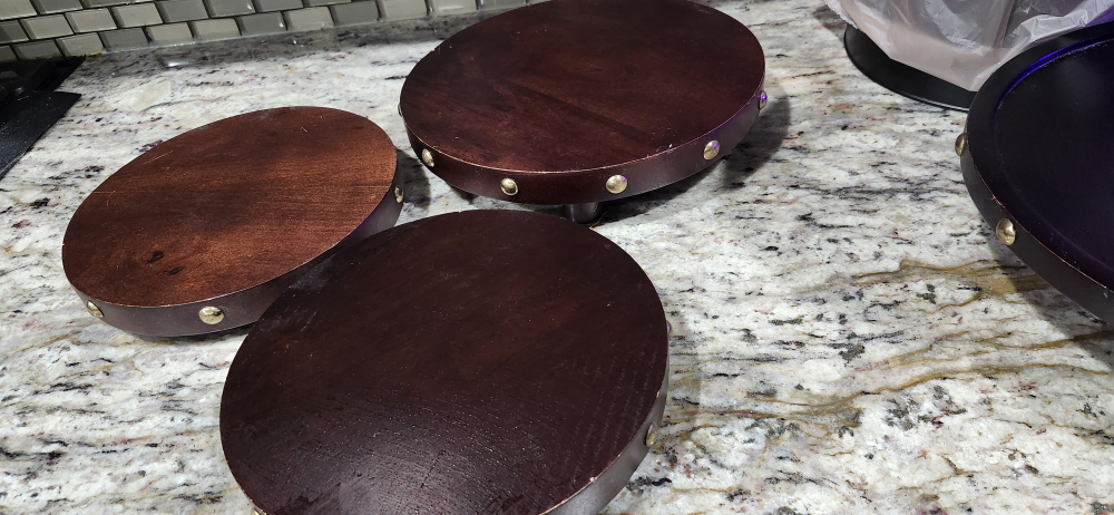 Set of three dark brown wooden risers