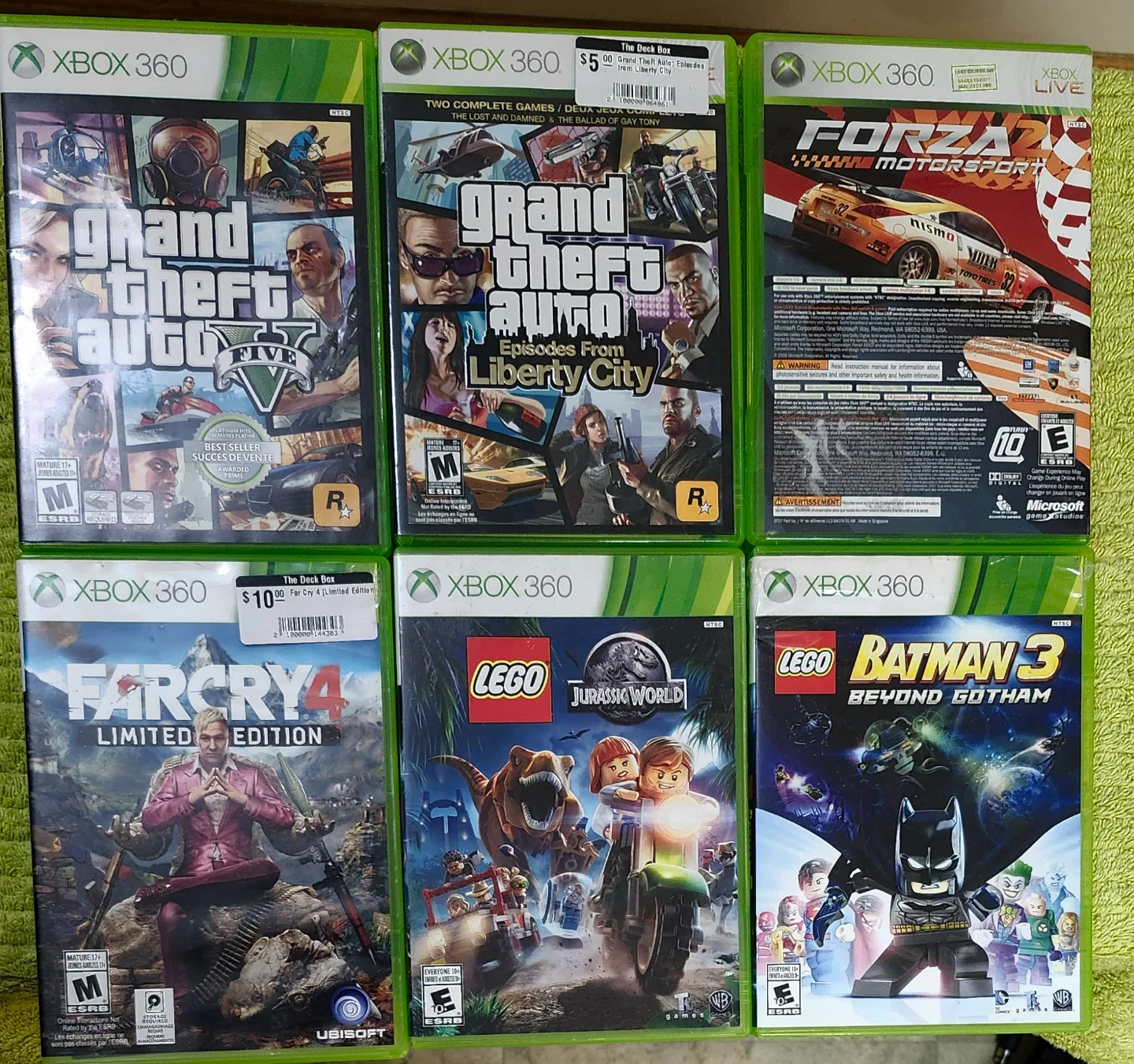 X box 360 e with all wires and wireless controller and 22 games image indicator(9)