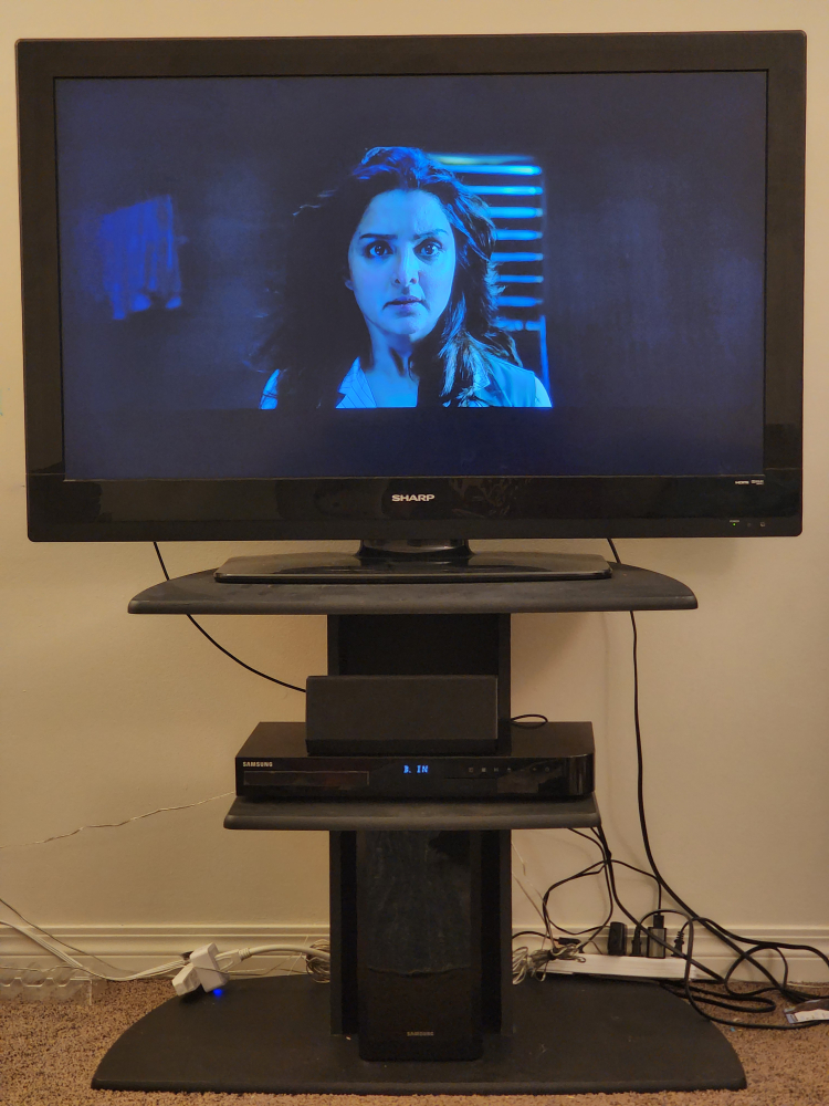 Sharp TV with Samsung Soundbar and Stand - photo 3