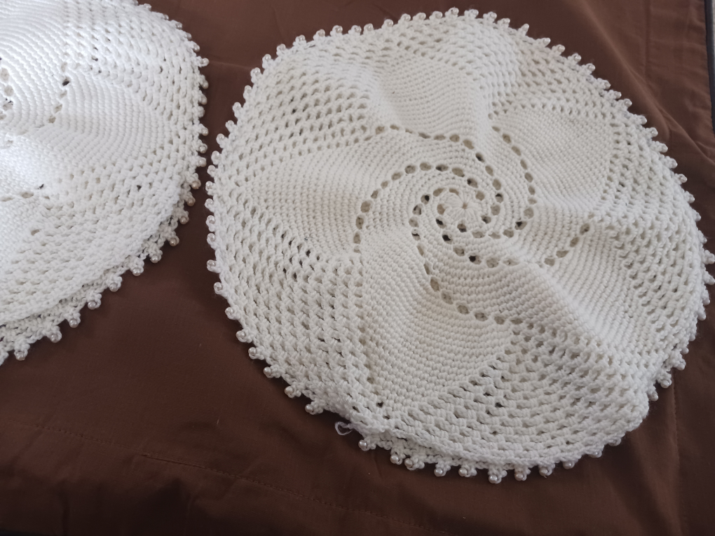 Pair of handmade crocheted doilies with pearl accents