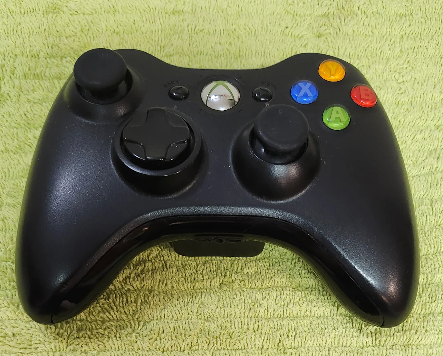 X box 360 e with all wires and wireless controller and 22 games image indicator(4)