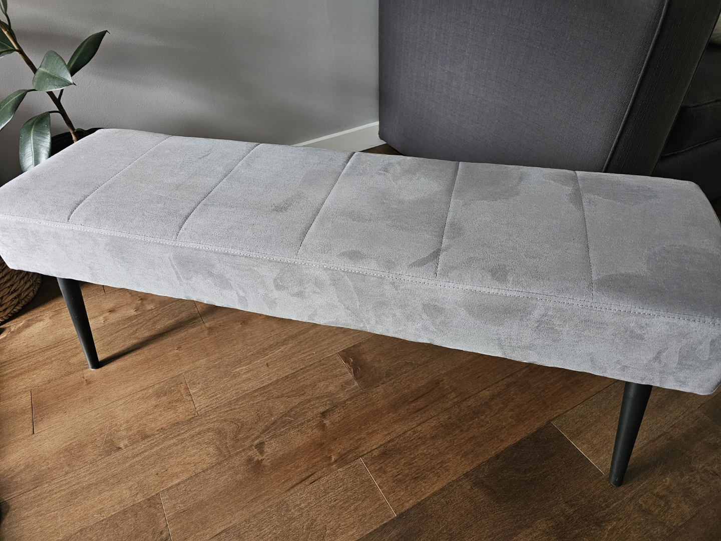 Grey Upholstered Bench with Black Legs
