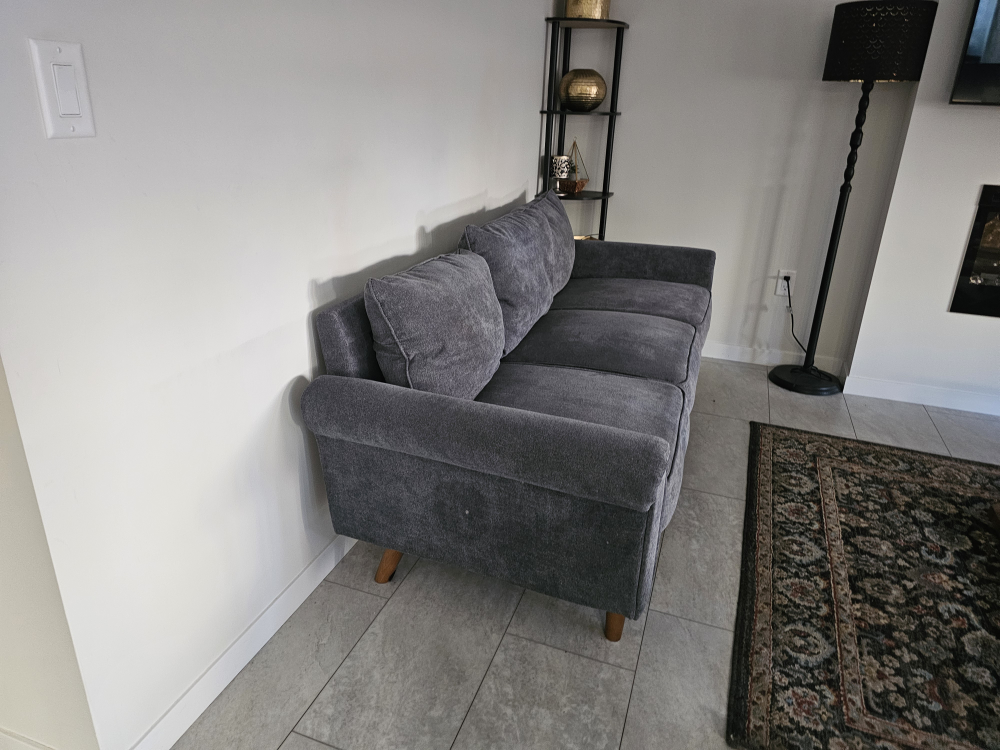 Grey fabric sofa with three cushions - photo 3