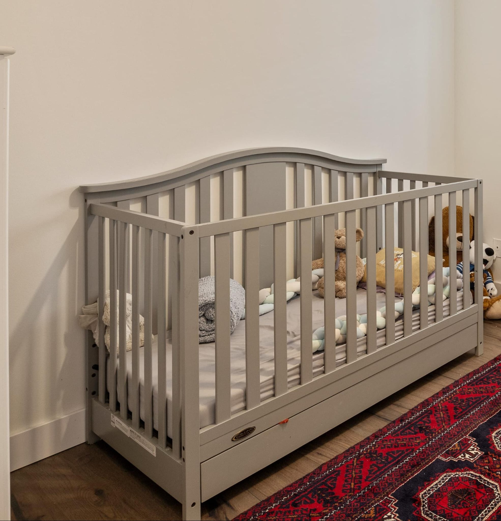 Grey Baby Crib with Storage Drawer