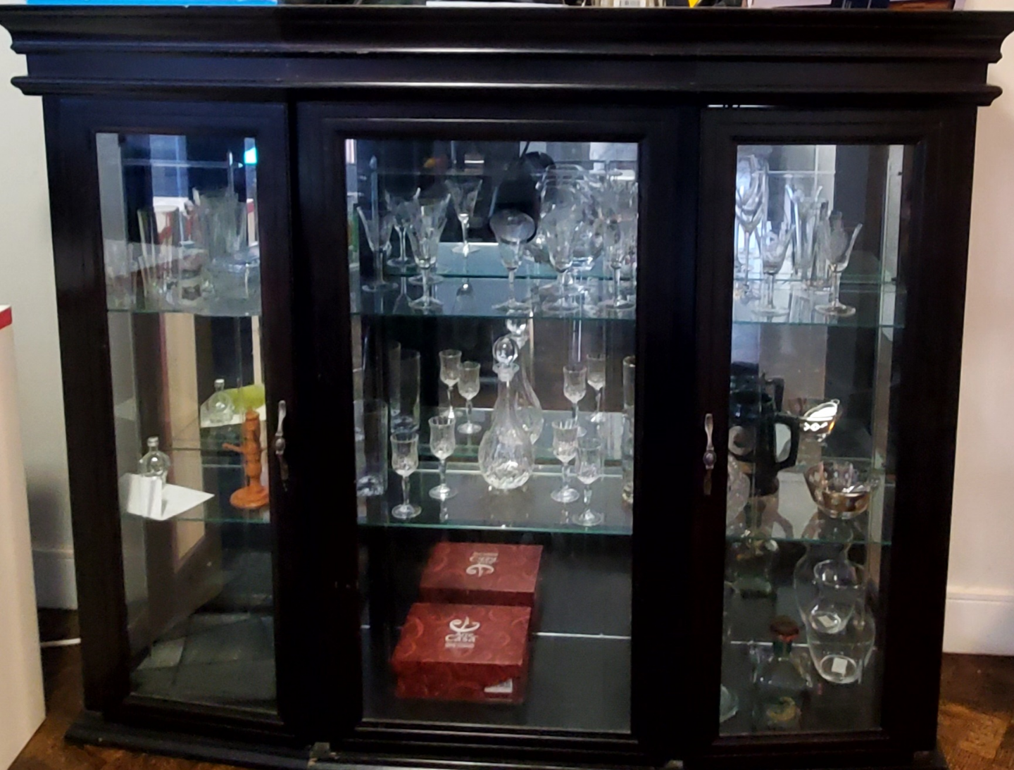 Dark brown wooden curio cabinet