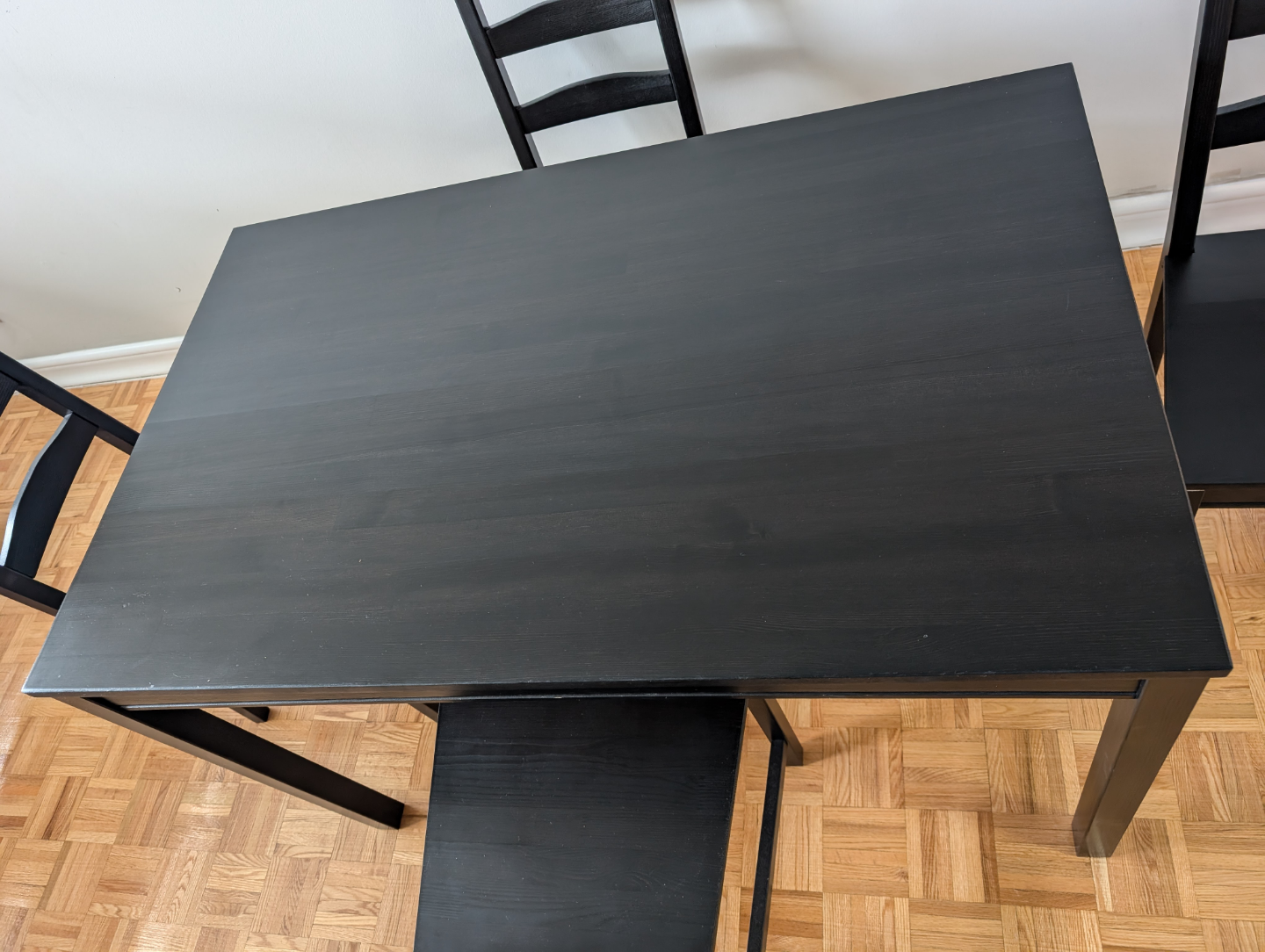 Black dining table and four chairs set