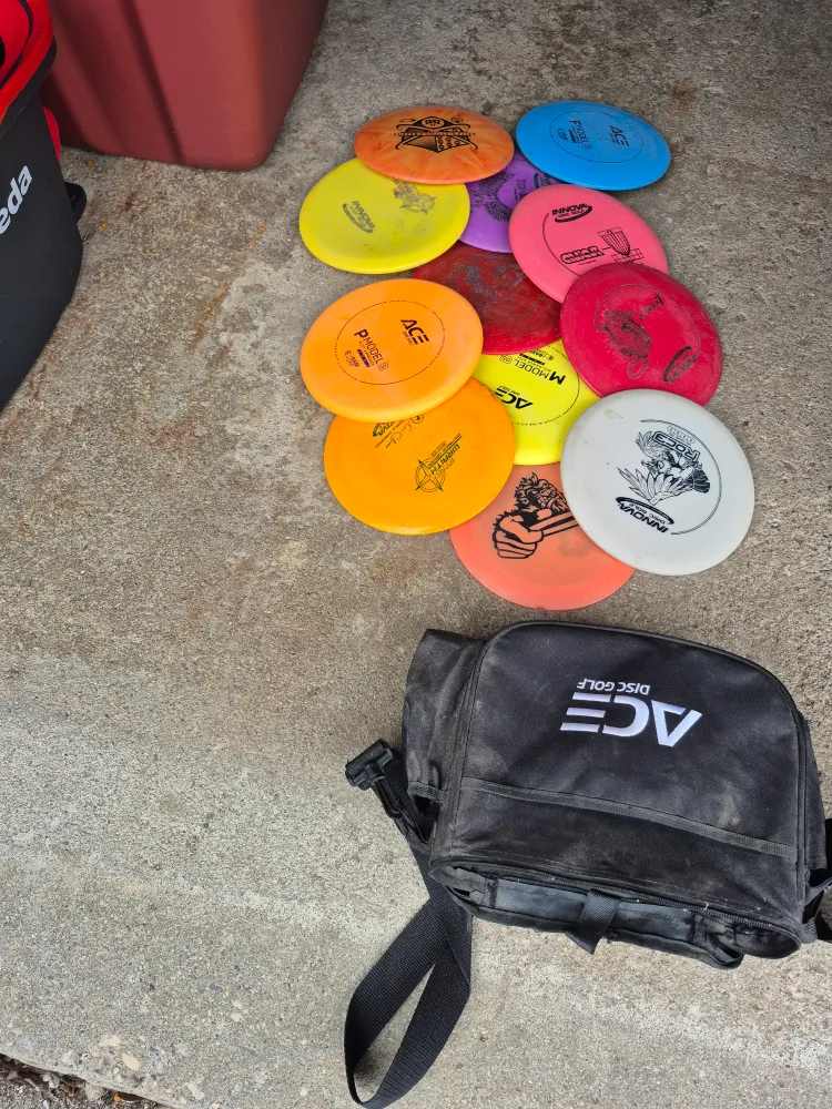 Lot of Used Discs and Disc Golf Bag