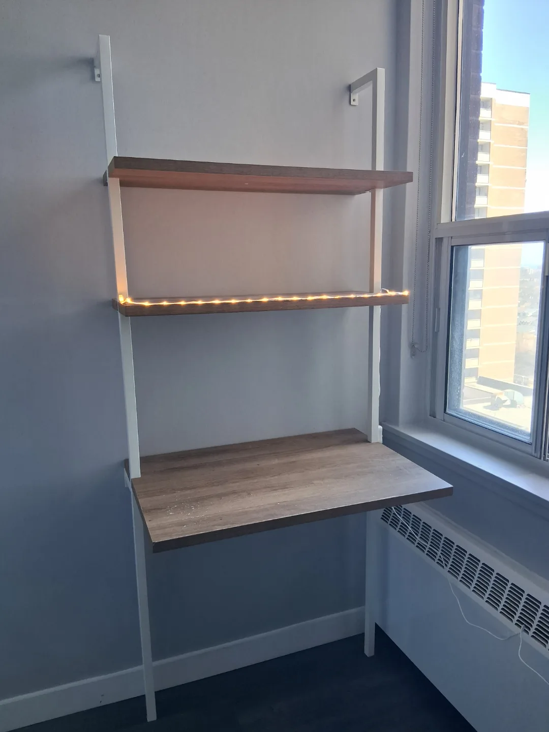 Wall-mounted desk with shelving unit image indicator(2)