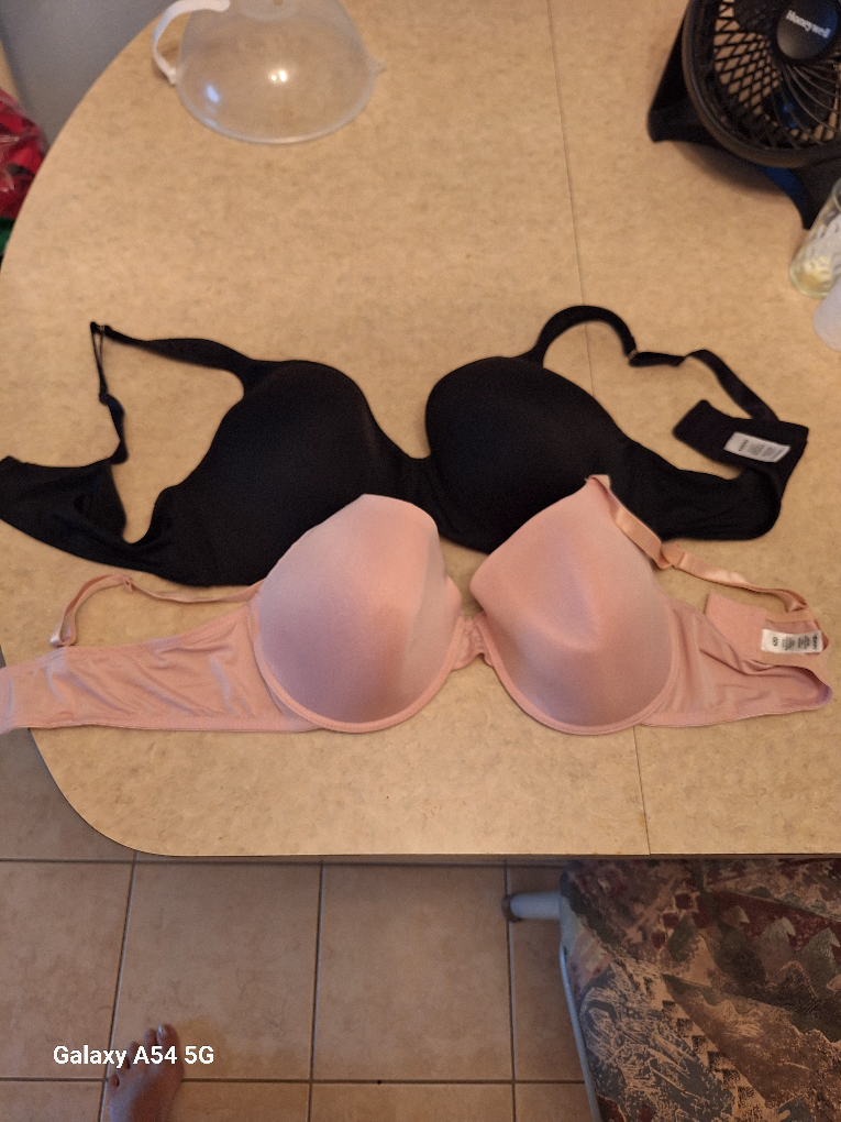 Two bras, black and pink