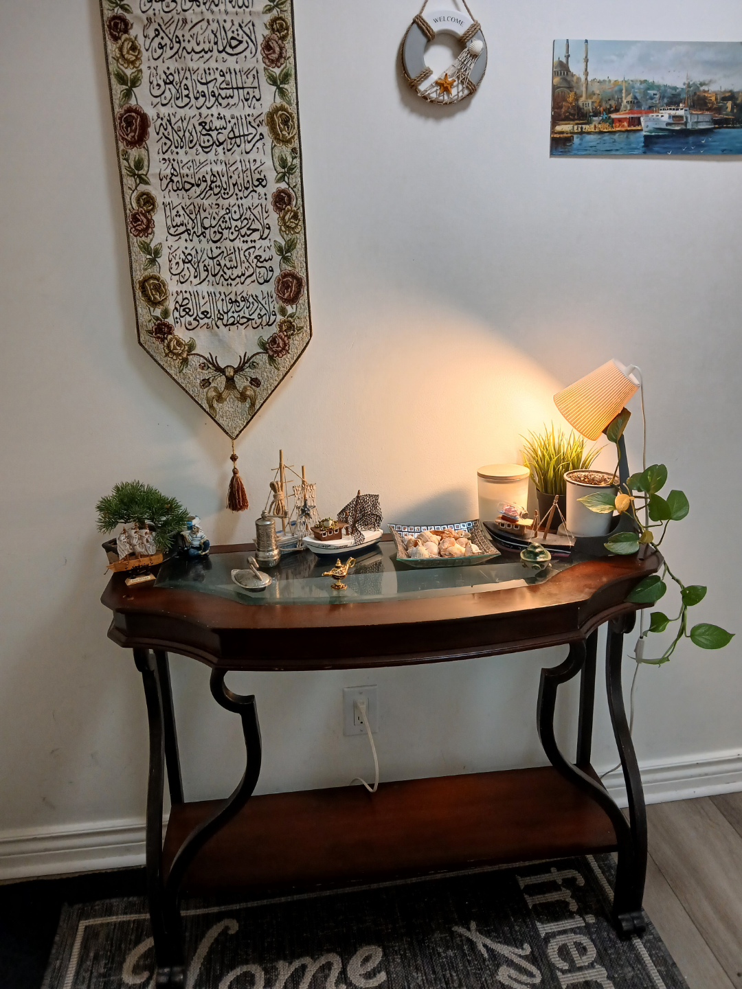 Dark wood console table with glass top