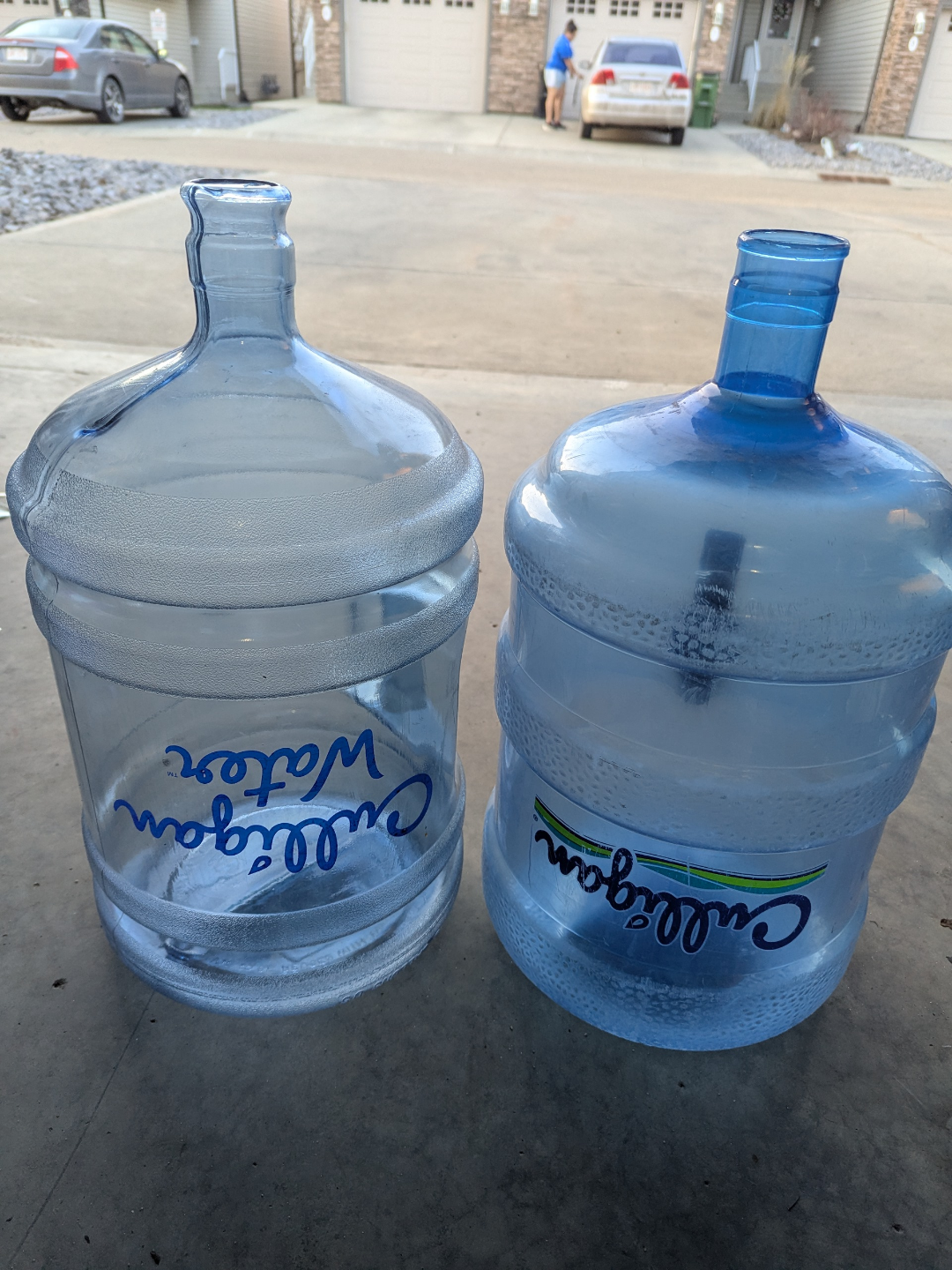Two empty 5-gallon water jugs -Culligan 5$ per bottle