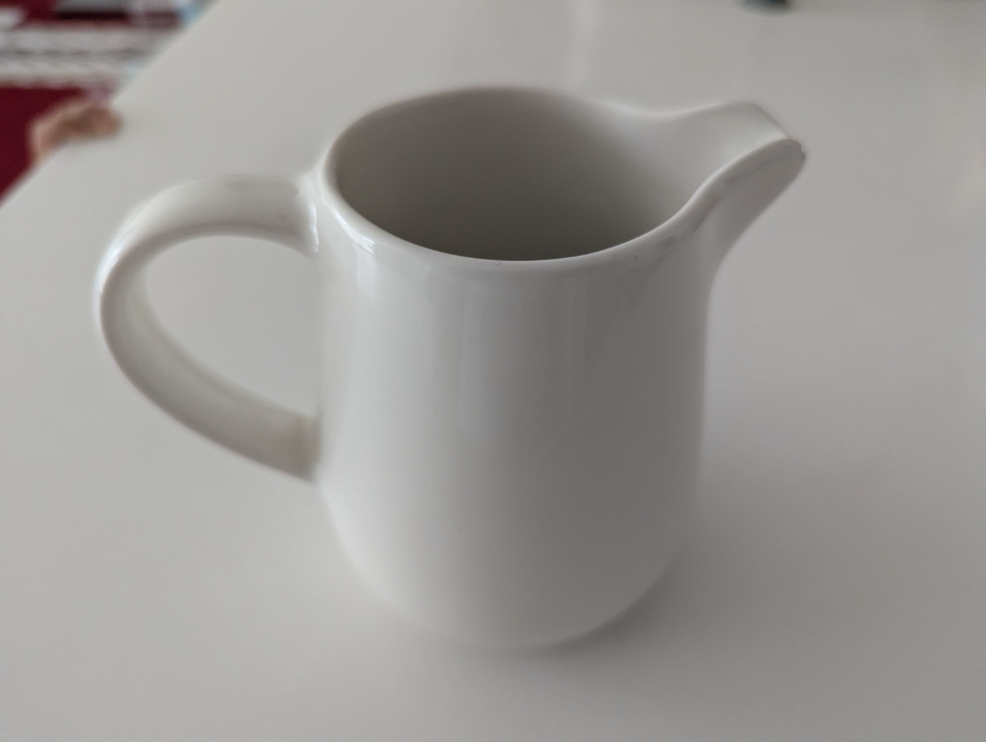 White ceramic creamer