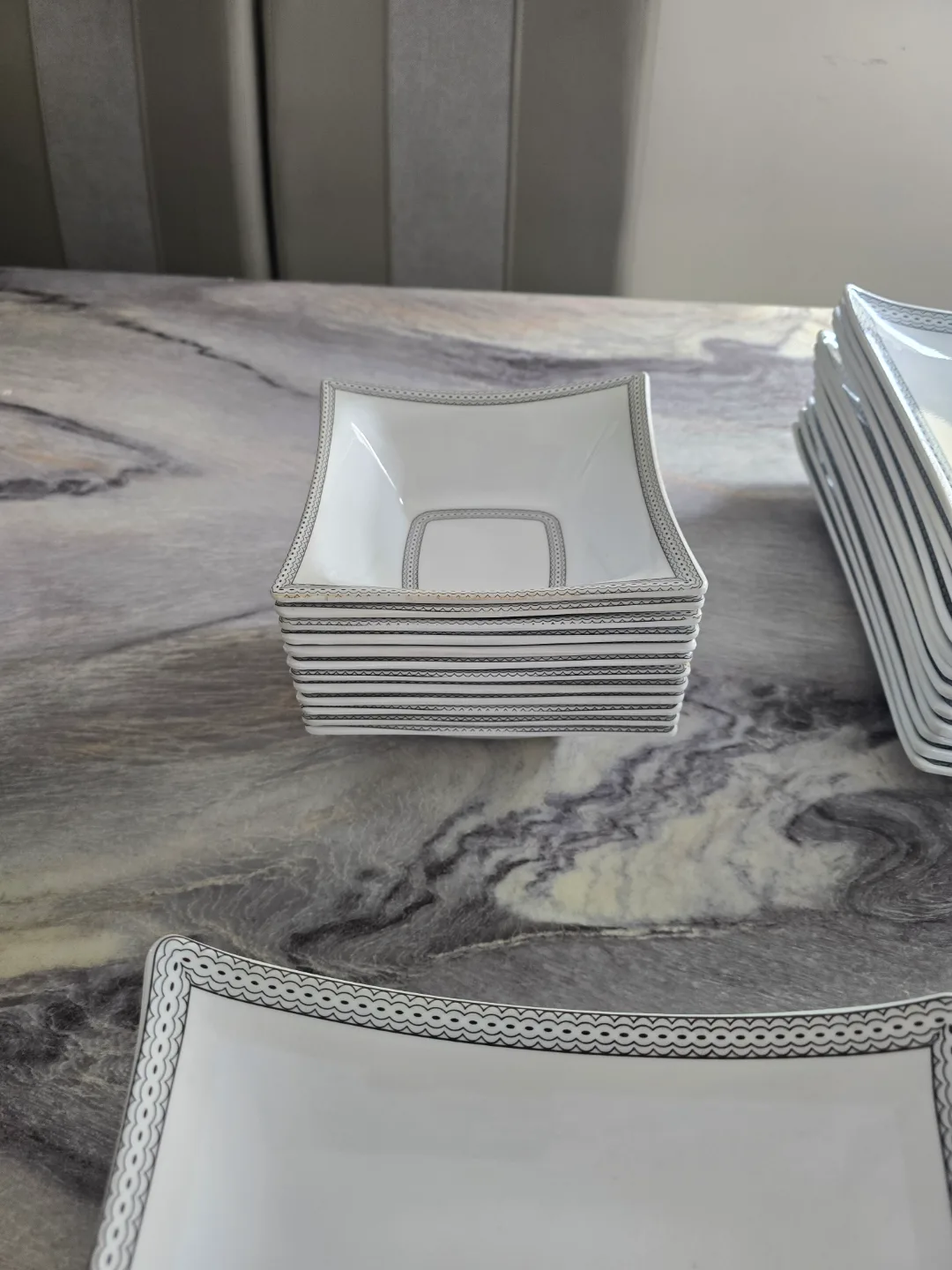 Elegant White Dinnerware Set with Silver Accents image indicator(7)