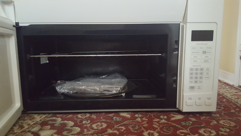 GE Over-the-Range Microwave - White - photo 2