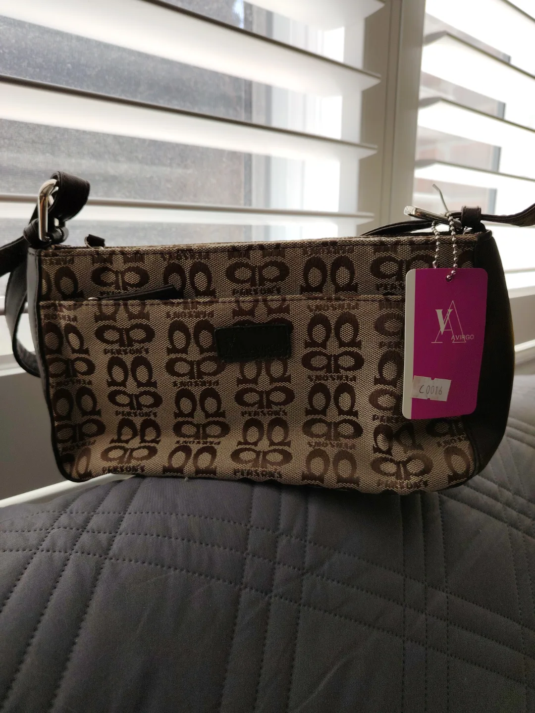 Person's beige and brown crossbody bag thumbnail