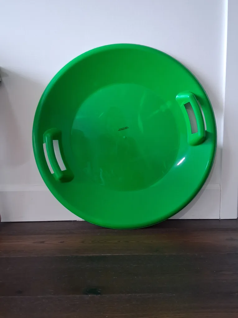 Green snow sled thumbnail