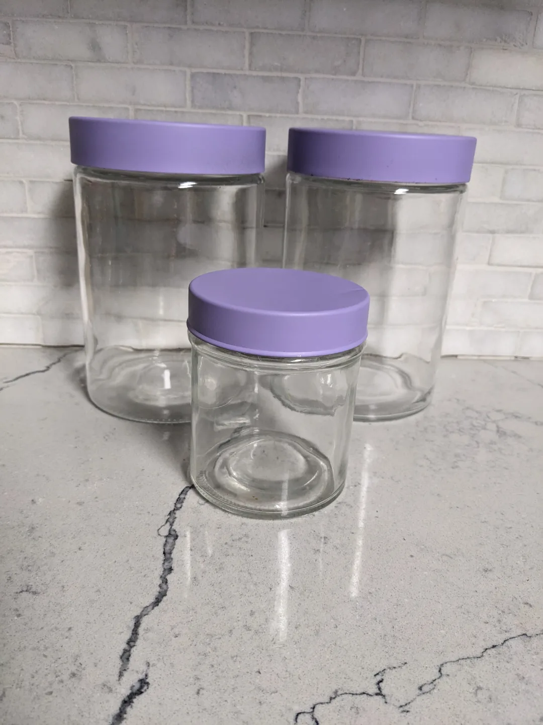 Set of 3 Glass Jars with Lavender Lids image indicator(2)
