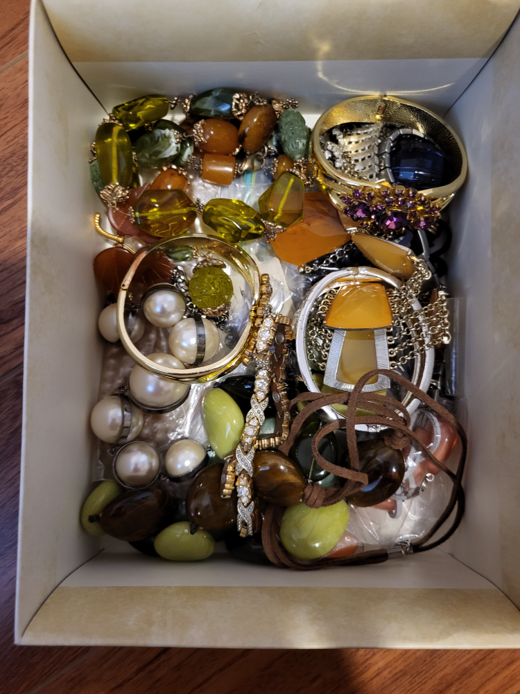 Box of women's bracelets and necklaces