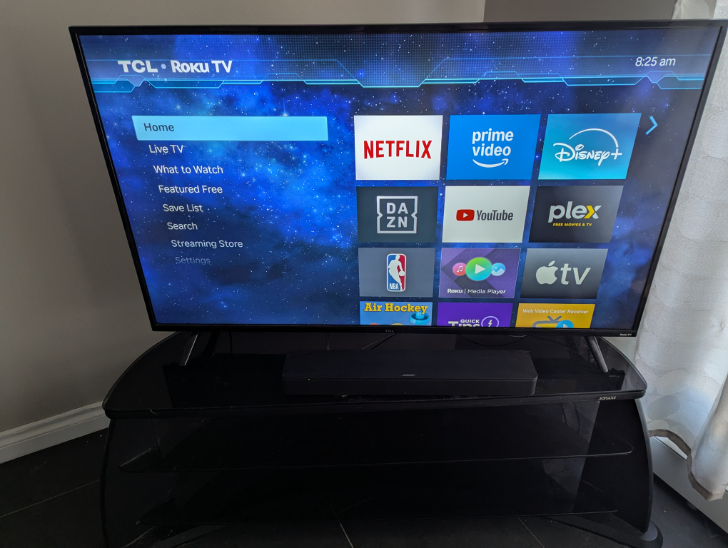 55 inch TCL Roku TV with Bose soundbar and TV stand