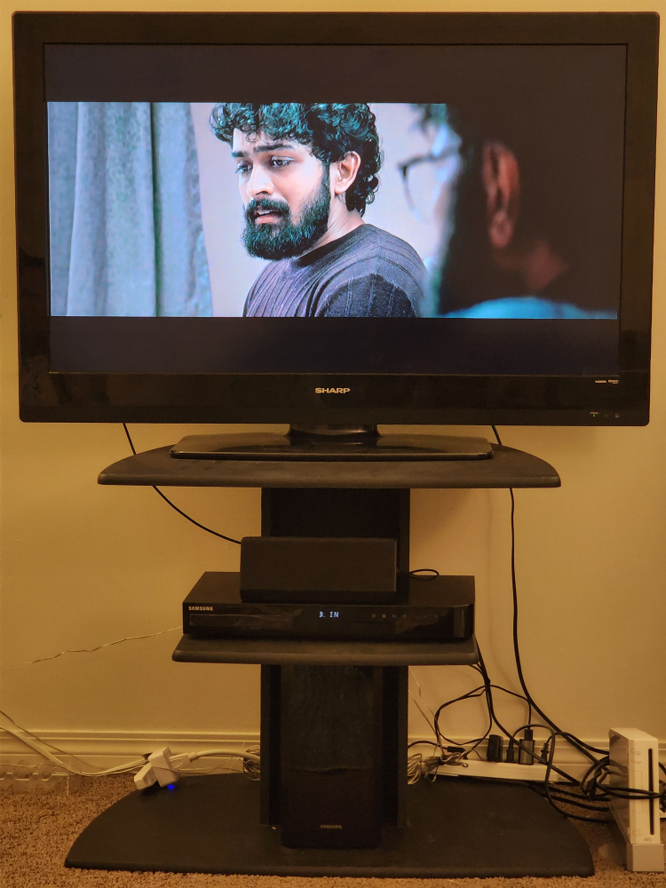 Sharp TV with Samsung Soundbar and Stand - photo 2