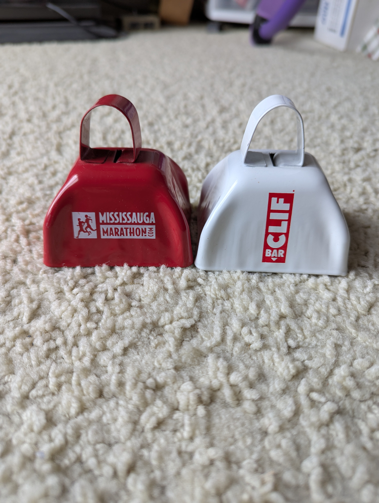 Two Mini Cowbells - Mississauga Marathon & CLIF Bar
