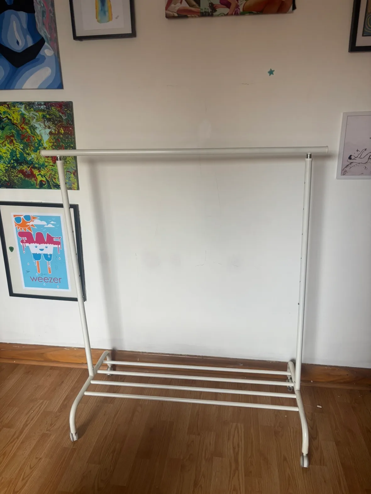 White clothing rack adjustable height and shoe rack built in