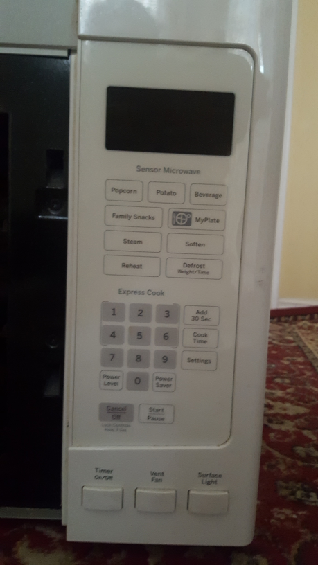 GE Over-the-Range Microwave - White - photo 3