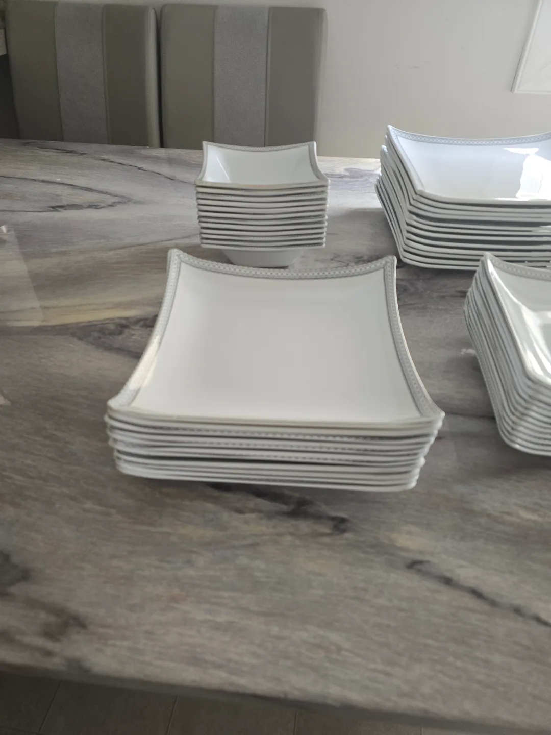 Elegant White Dinnerware Set with Silver Accents image indicator(8)