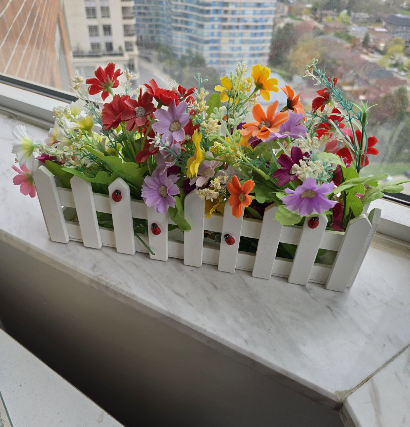 Artificial Flower Arrangement in White Picket Fence Planter Box