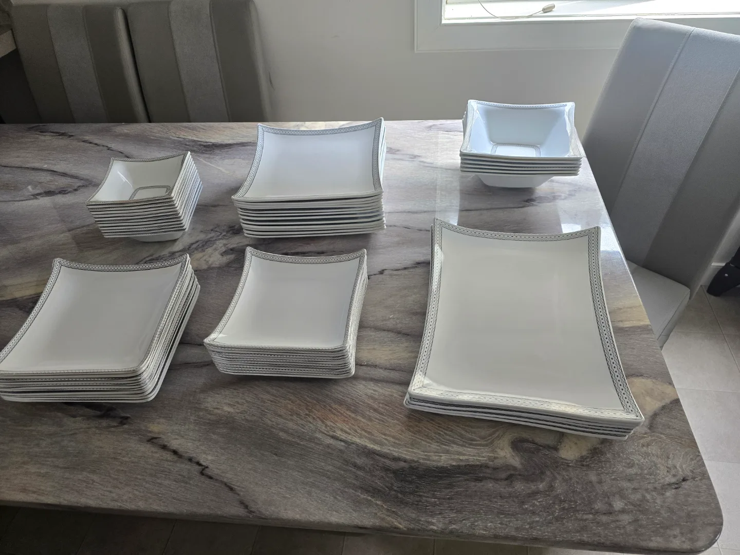 Elegant White Dinnerware Set with Silver Accents image indicator(2)