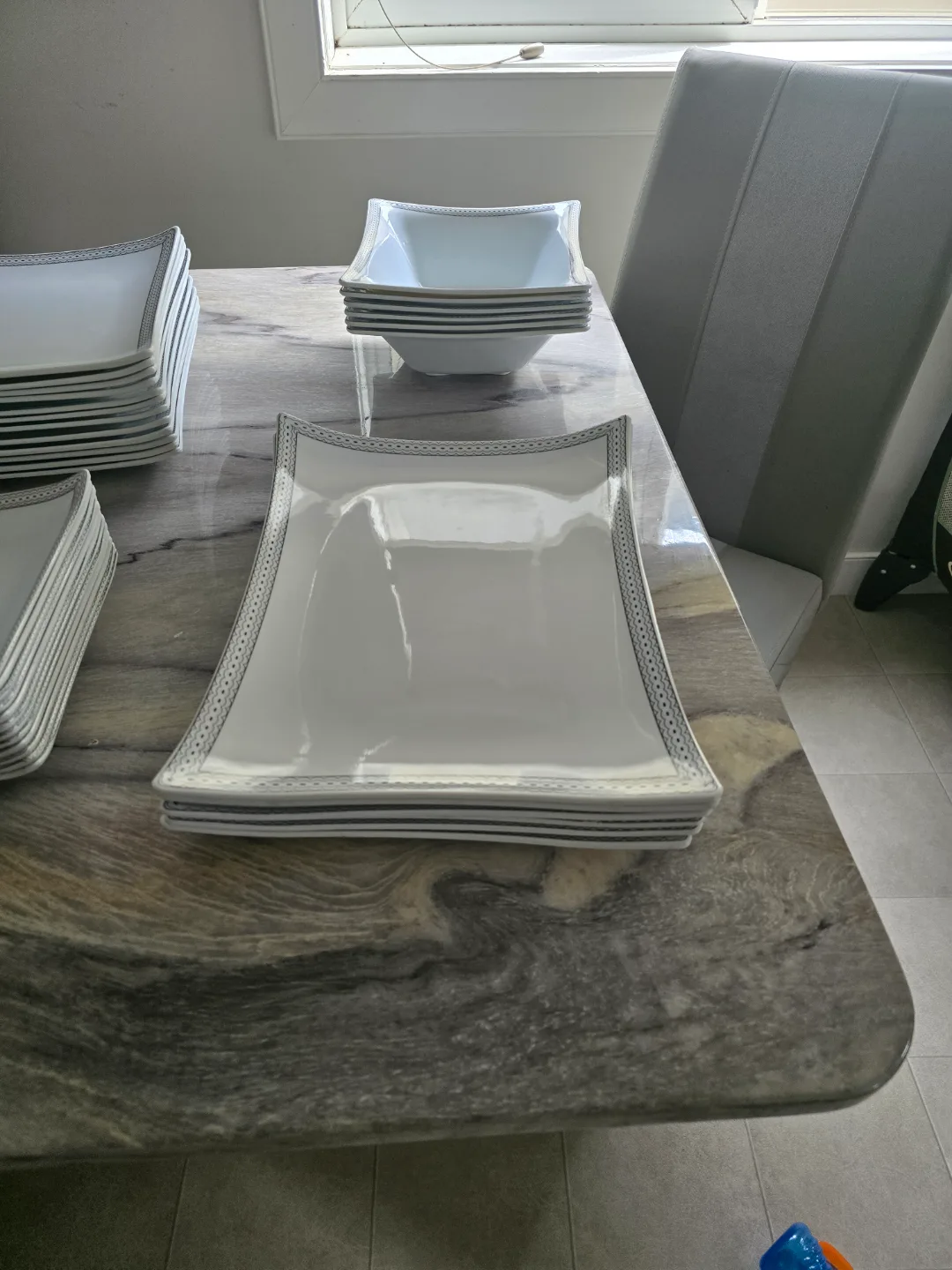 Elegant White Dinnerware Set with Silver Accents image indicator(4)