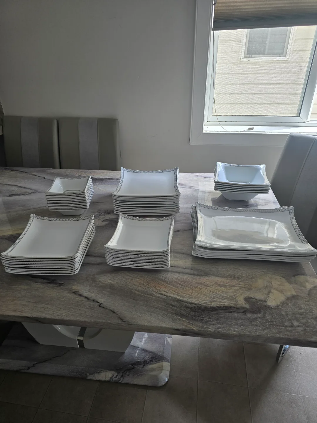 Elegant White Dinnerware Set with Silver Accents image indicator(9)