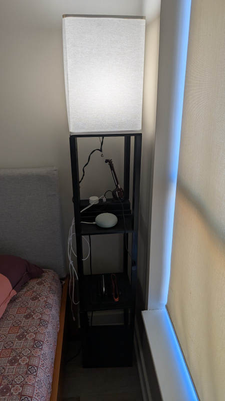 Black floor lamp with shelving