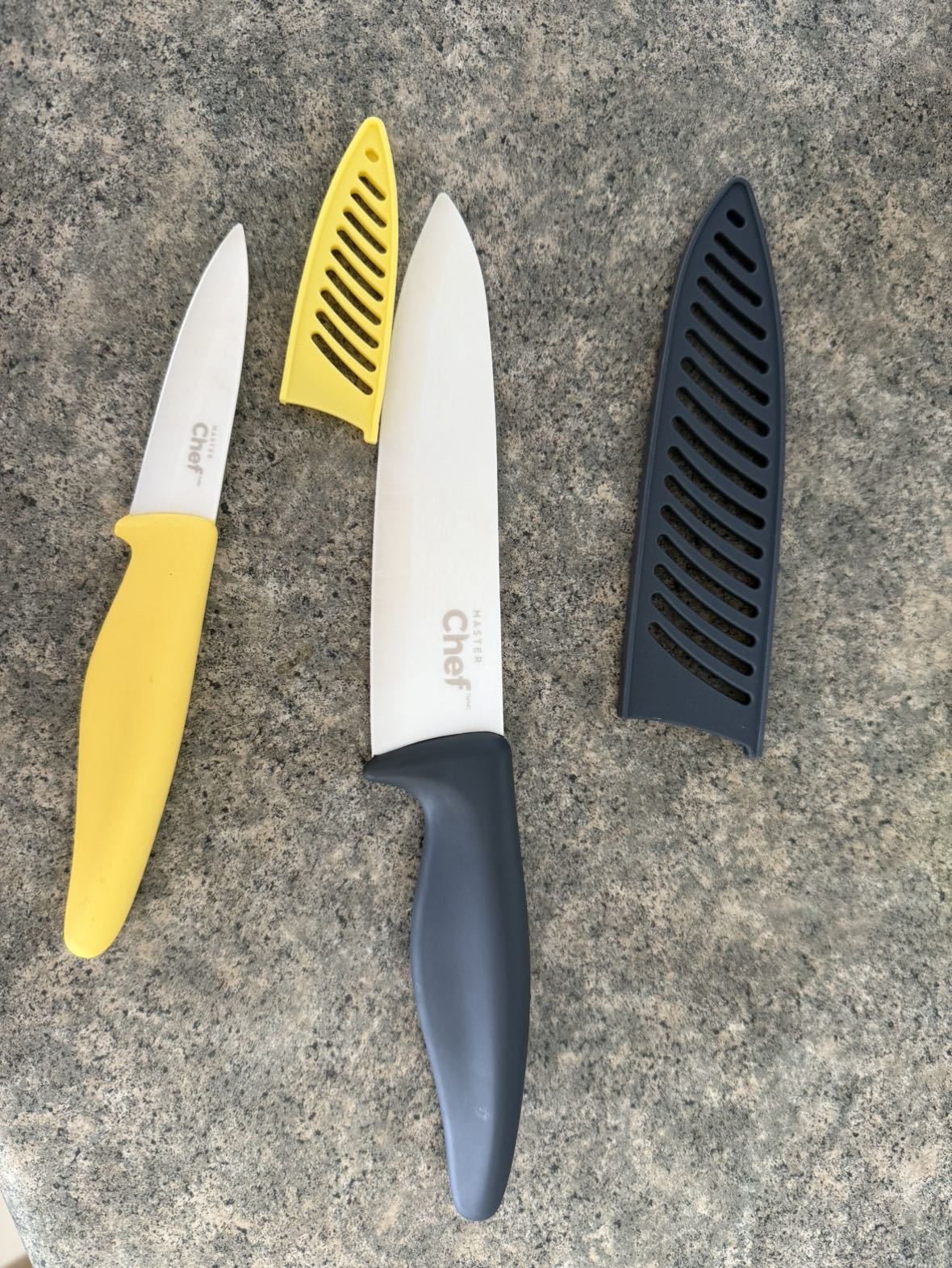 Two ceramic knives with sheaths