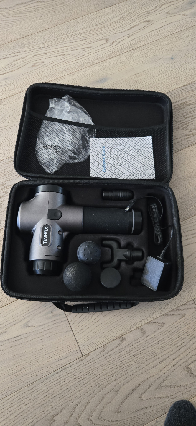 therapeutic massage gun with accessories