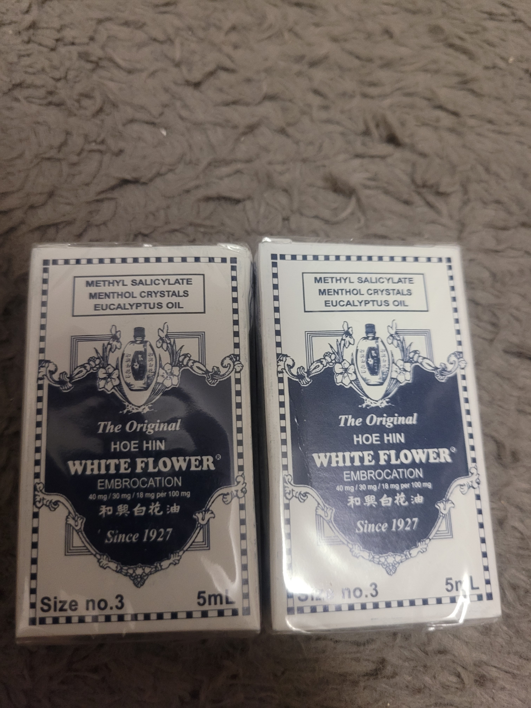 Two bottles of Hoe Hin White Flower Embrocation