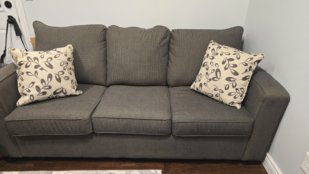 Grey pull out Couch. barely used - photo 2