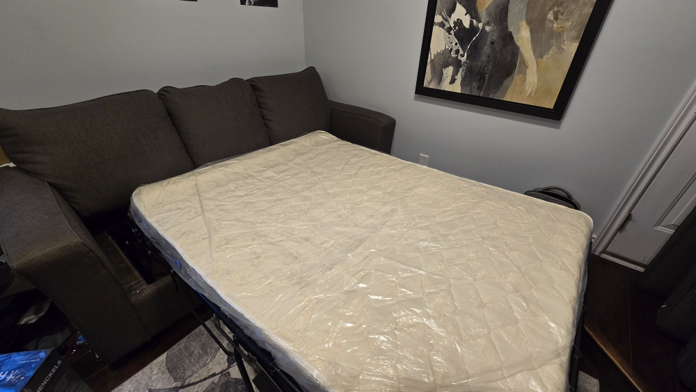 Grey pull out Couch. barely used - photo 3