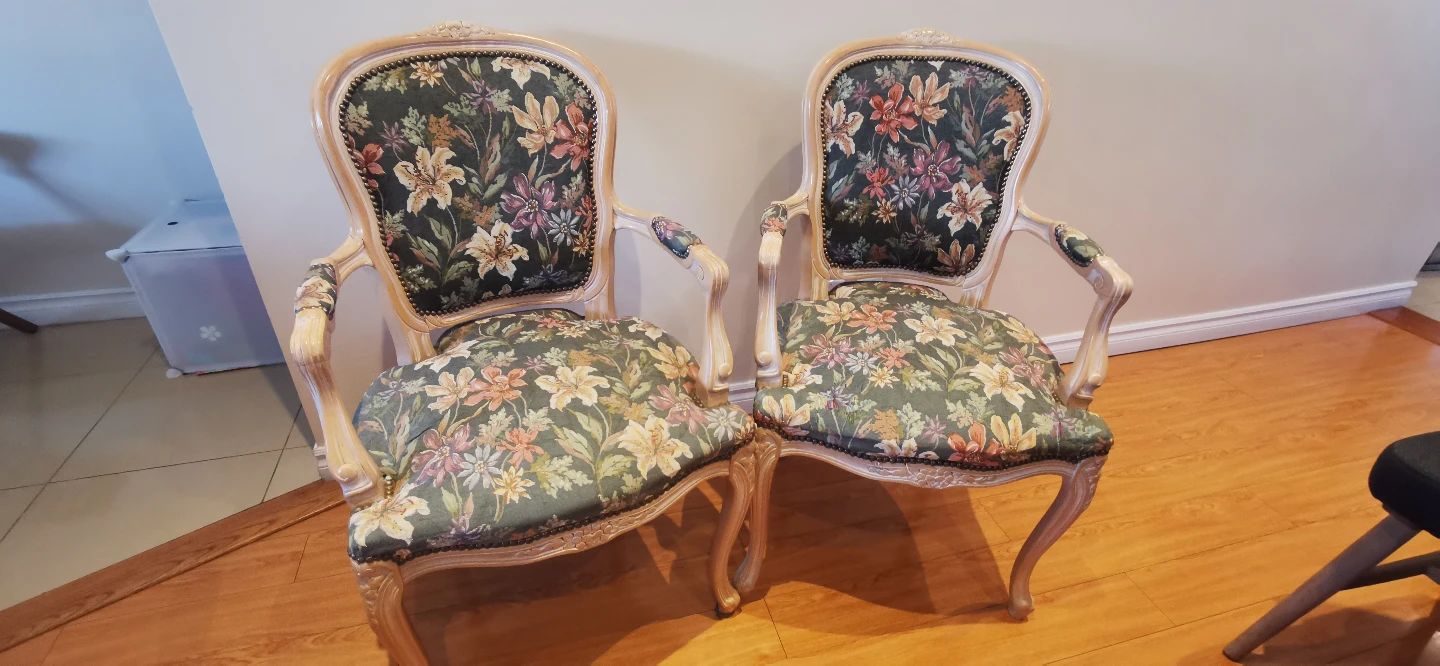 Pair of Elegant Dining Chairs with Floral Upholstery