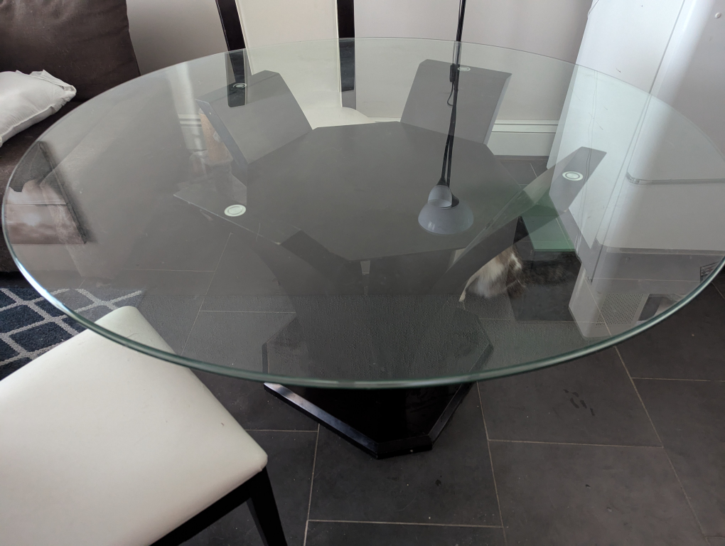 Glass-top dining table and four chairs