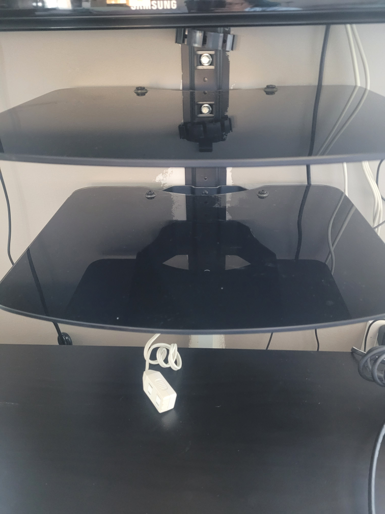 Wall-mounted TV stand with two shelves