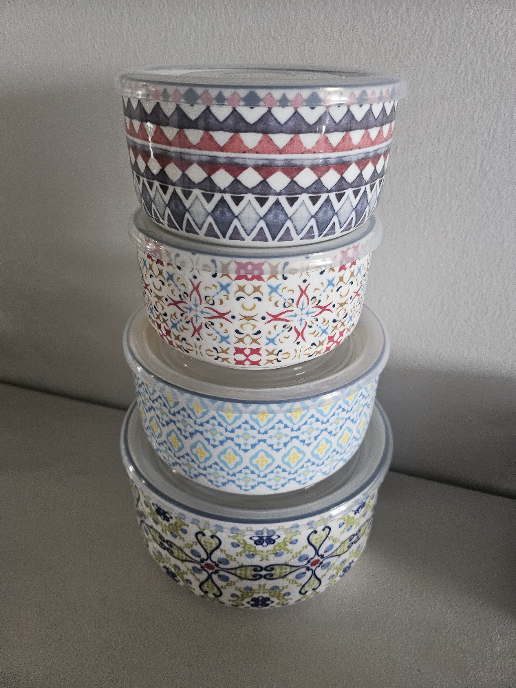 Set of four ceramic bowls with lids