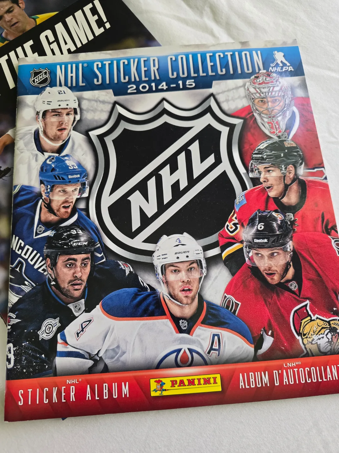 assorted sport posters, cards, pucks and games image indicator(8)