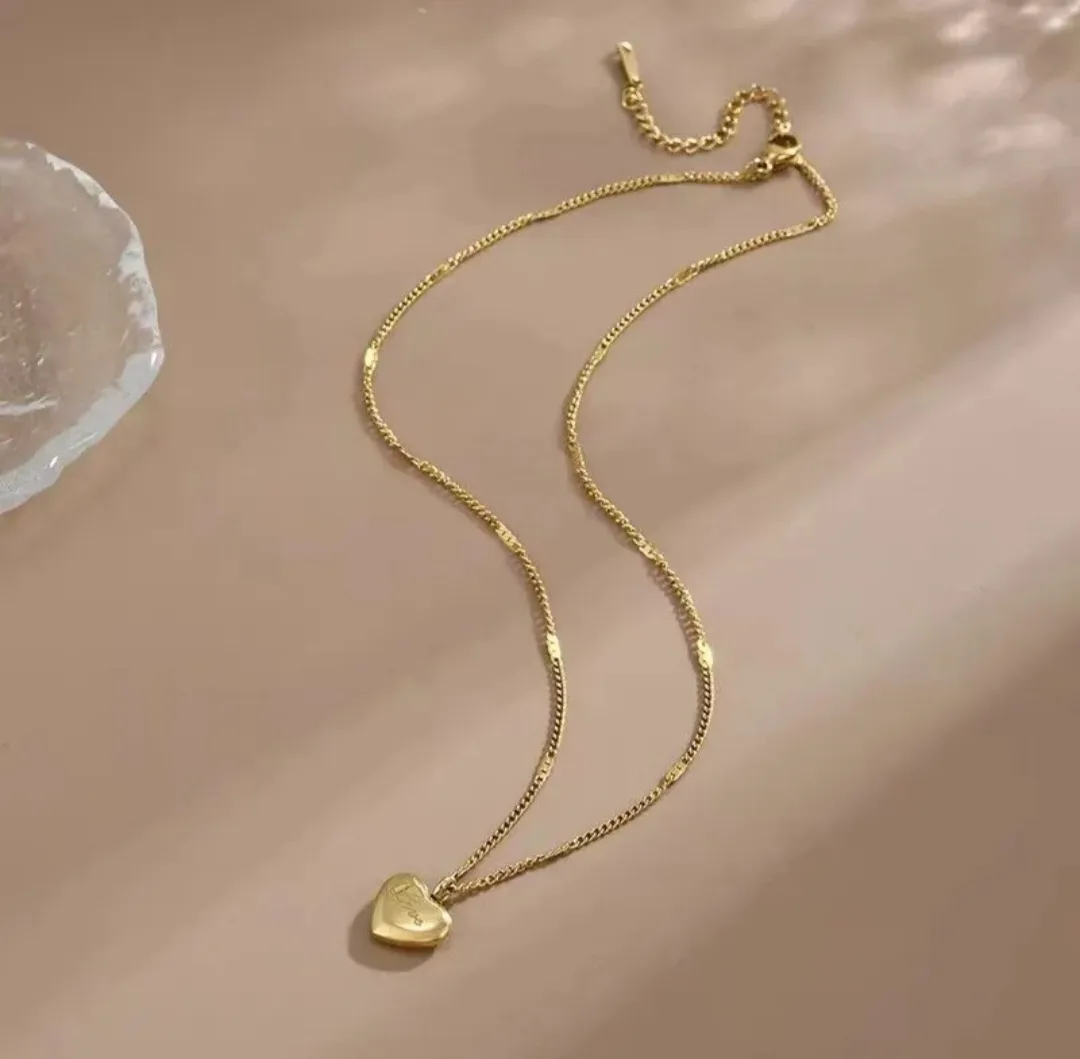 Gold Heart Necklace with 'Love' Inscription image indicator(3)